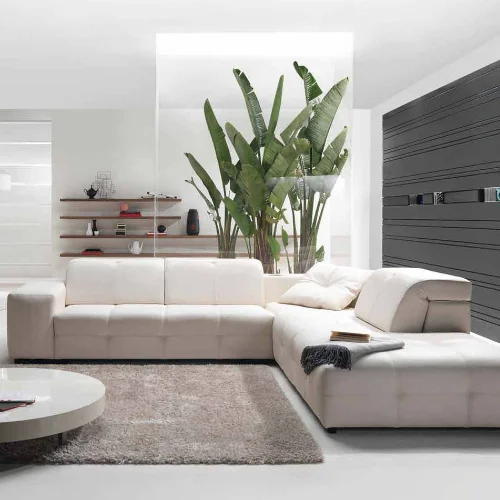 How do you decorate your living room furniture with an L-shaped sofa in Dubai?